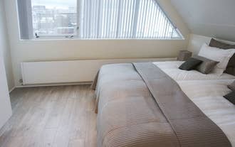 The bedrooms of Penthouse Downtown have excellent views of the city.