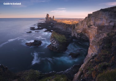 Arnarstapi on the Snæfellsnes Peninsula in West Iceland is a unique lava rock formation constantly battered by the waves of the Atlantic Ocean.