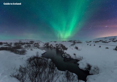 The magnificent auroras dance across the sky.