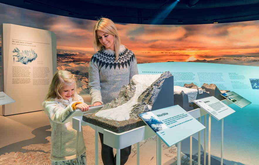 A child exploring the exhibits at Perlan Museum in Reykjavik.