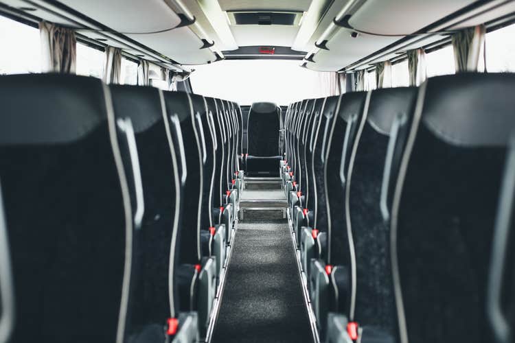 The seats inside the bus seen empty.