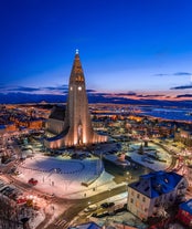 Hallgrimskirkja church towers over the beautiful city of Reykjavik in Iceland.