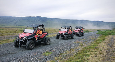 Two buggies crossing a river in the Thorsmork valley.