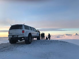 A group gets out of their monster truck during a private tour for magnificent vistas from the Langjokull glacier.