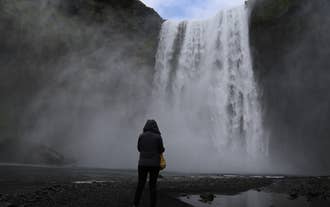When viewing Skogafoss waterfall up close, make sure to wear a raincoat or jacket.