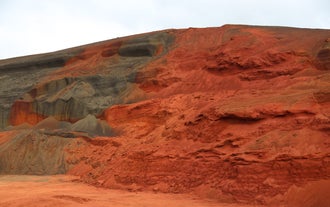 A brilliant red-colored rock in Iceland.