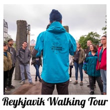 A group on a walking tour in Iceland with an expert guide.