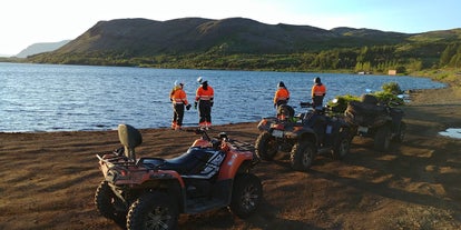 ATV riders stop for a photo opportunity by a lake outside Reykjavik.