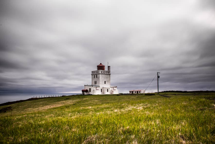 Dyrholaey Lighthouse under grey cloud near Vik, on the wettest stretch of Iceland's South Coast at 67 inches of rain a year.