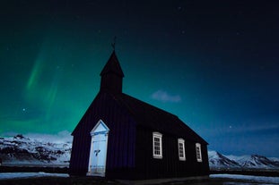 The Buðir Black Church overlooks the ocean on Iceland's Snæfellsnes Peninsula.