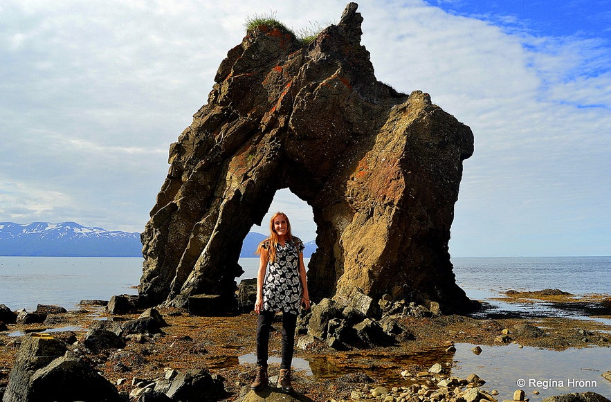 Regína by the Gatanöf arch-rock on Bakkahöfði cape North-Iceland