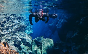 Man snorkeling at Silfra in Thingvellir National Park