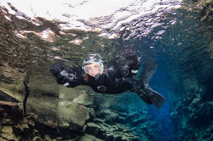 Woman snorkeling at Silfra in Thingvellir National Park