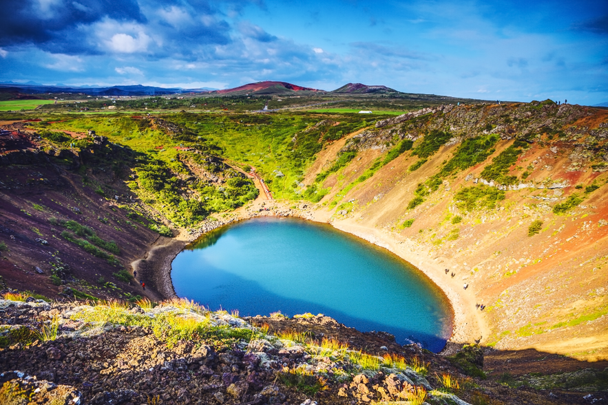 Kerid Crater Lake on a sunny day, a popular stop on Golden Circle tours run by top tour companies in Iceland.