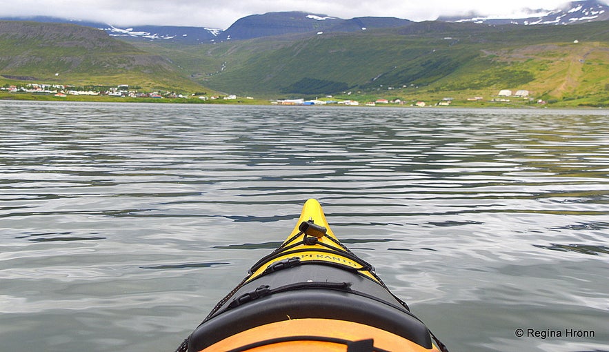 Kayaking by Ísafjörður town in the Westfjords of Iceland