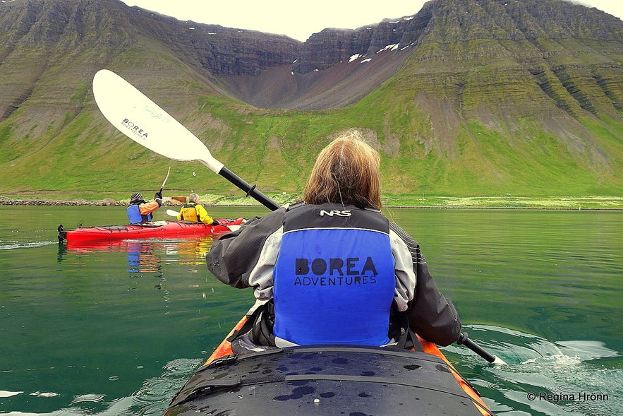 Regína Kayaking by Ísafjörður town in the Westfjords of Iceland