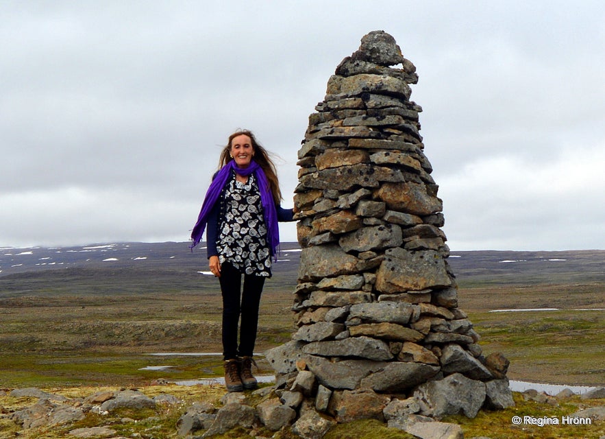 Regína by An old tall cairn on Þorskafjarðarheiði heath in the Westfjords of Iceland