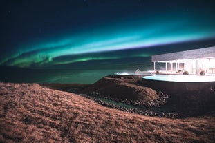 GeoSea Geothermal Sea Baths illuminated by a display of the northern lights.