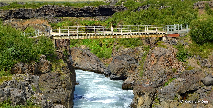 The pedestrian bridge by Barnafoss waterfall