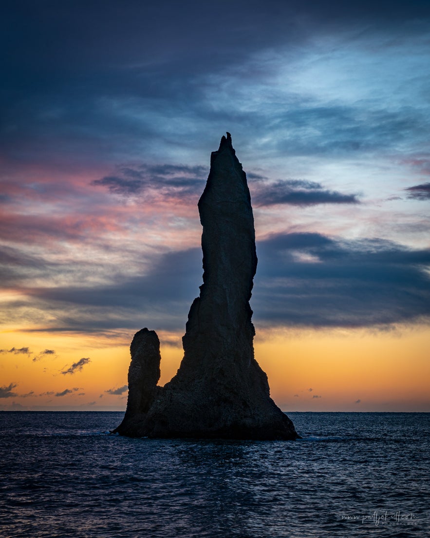 One of the Reynisdrangar sea stacks at sunrise.