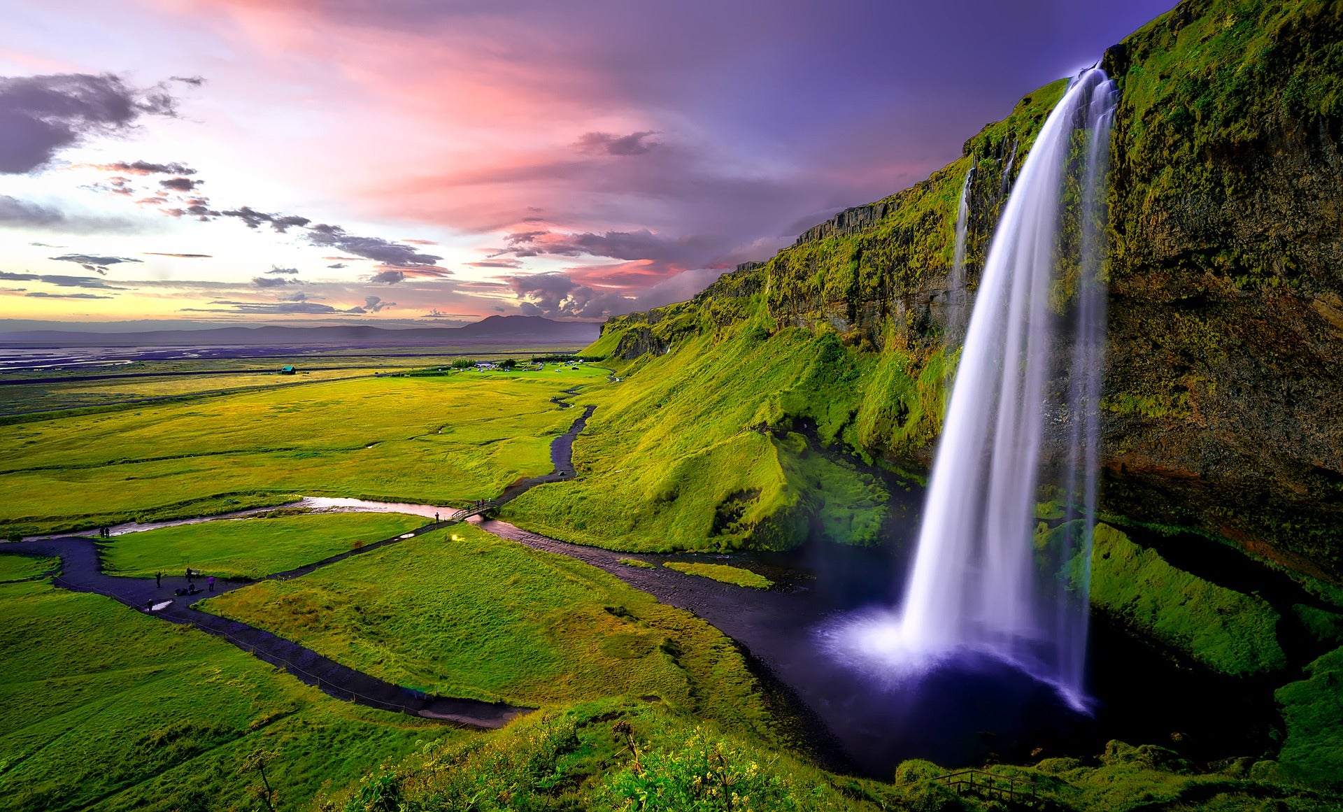 Seljalandfoss in South Iceland with pink skies
