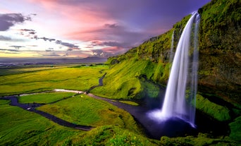 Seljalandfoss in South Iceland with pink skies