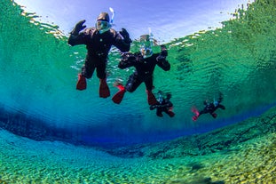 Two people snorkelling in Silfra