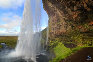 Seljalandsfoss waterfall is breathtakingly beautiful and has a path circling it for a unique perspective behind the falls.