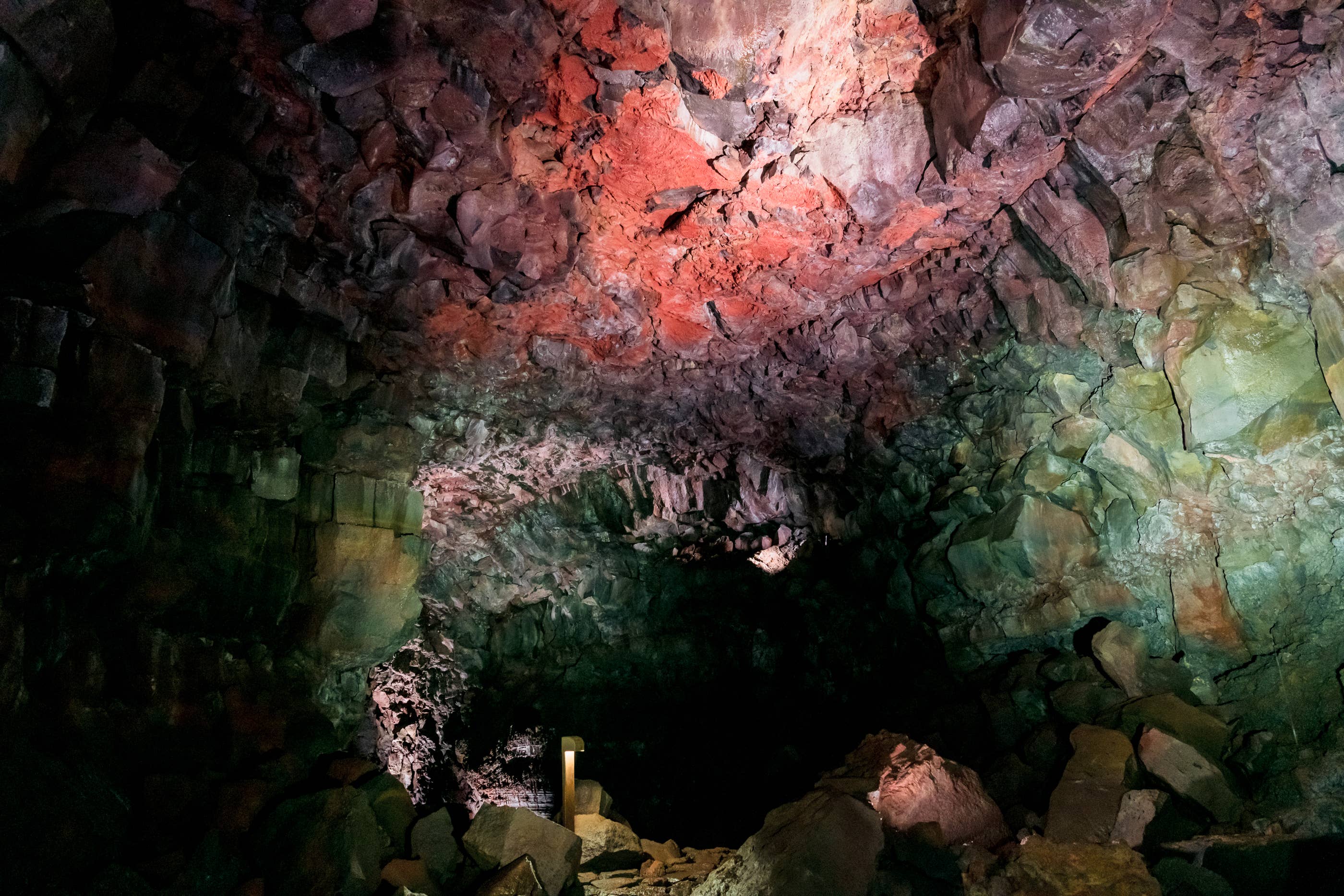 The walls inside the Raufarholshellir lava cave sport rainbow colors.