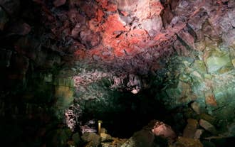 The walls inside the Raufarholshellir lava cave sport rainbow colors.