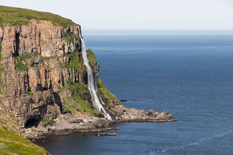 Migandifoss drops off a cliff by the Trollaskagi road into the ocean