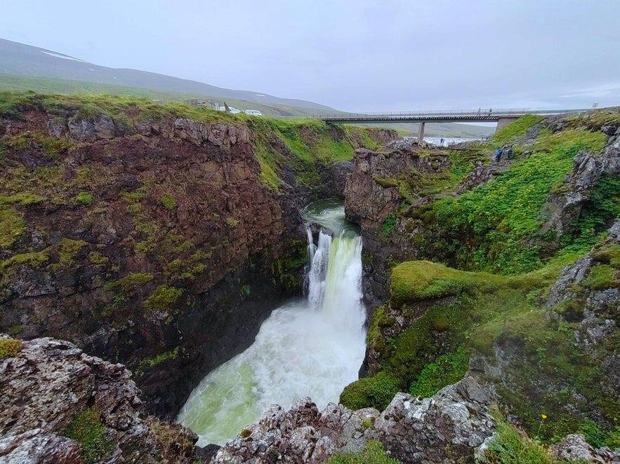 One of the Kolugljufur waterfalls is stained green!