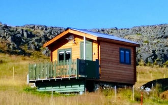 Sea Cape Cabin 3, a wooden cabin with a terrace at the front.
