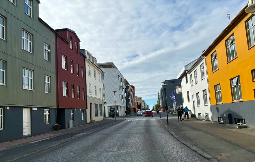 A view of Hverfisgata Street with its colorful houses and blue skies.