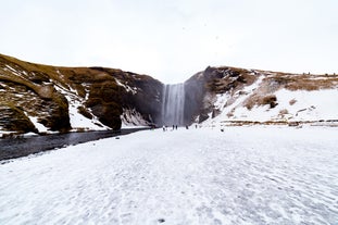 Skogafoss waterfall blanketed in snow