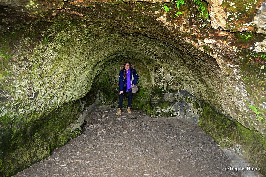 Regína inside Baðstofuhellir - the Cave of the Pastor of Fire