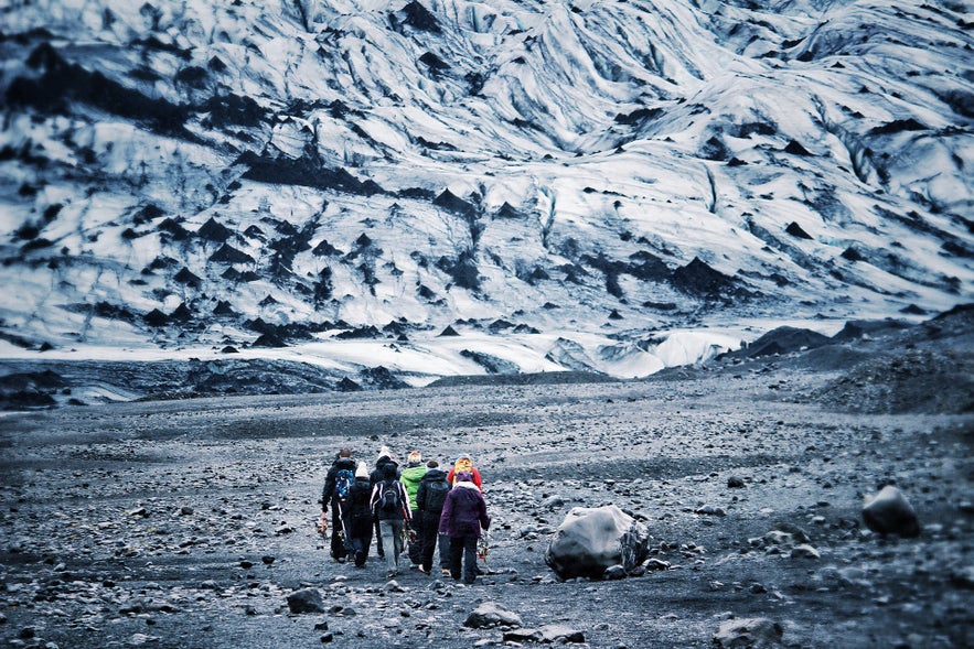 people glacier hiking in Iceland in the snow