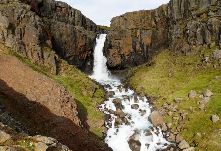 Fardagafoss waterfall seen on a summer day.