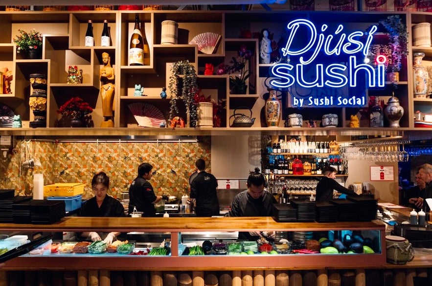 People making sushi at a food hall in Reykjavik