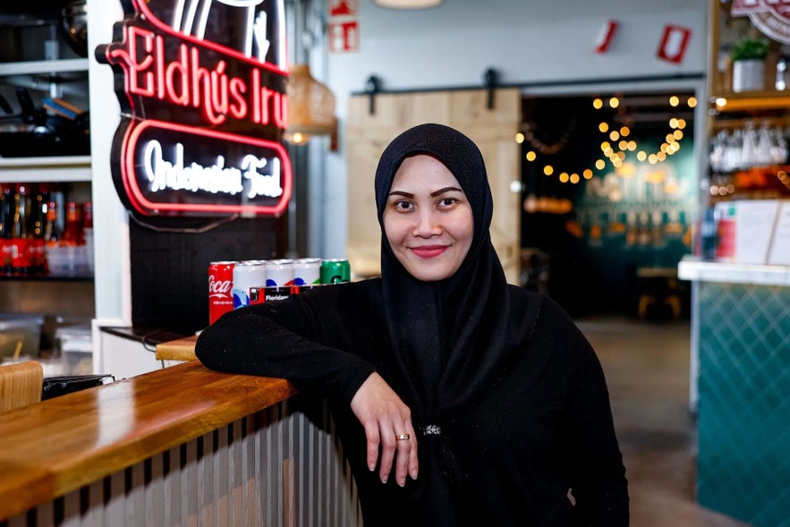 Woman standing in front of her resturant in reykjavik