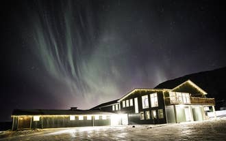 The Northern Lights dance over Hotel Efstidalur.