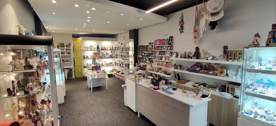 Interior of Gjafir Jarðar gift shop in Reykjavik, Iceland, featuring shelves of crystals, dreamcatchers, handmade crafts, spiritual books, and unique Icelandic souvenirs in a bright and welcoming space.