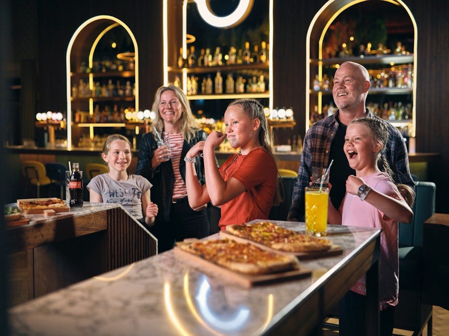 family having fun at Oche cocktail and darts bar