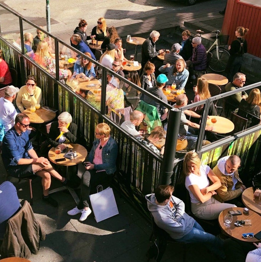 People enjoying bastard drinks and food in Iceland