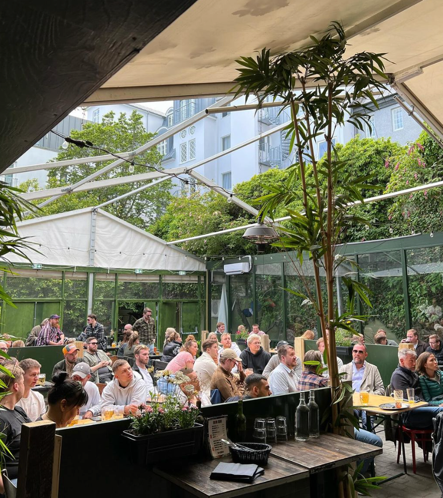 People sitting in the sunny beergarden in Iceland