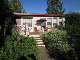 The beautiful exterior of the Laugar Guesthouse.