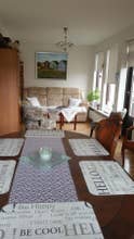 The Laugar Guesthouse's bright and cozy living room.