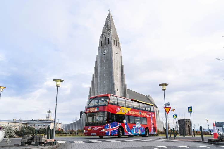The Hop-On Hop-Off bus parked in front of Hallgrimskirkja church