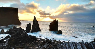 Fascinating rock stacks peek near the shore at Reykjanes peninsula.