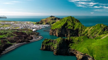 The Westman Islands combine lush greenery and rugged landscapes.